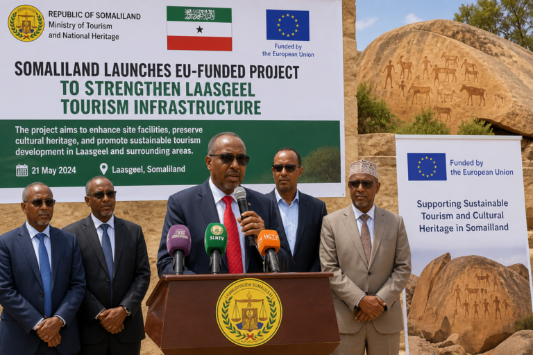 A speaker announces the launch of an EU-funded project to enhance tourism infrastructure in Laasgeel, Somaliland, with others present